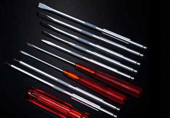 Screwdriver and center punch. Mechanic hand tools. Screwdriver sets with interchangeable blades....