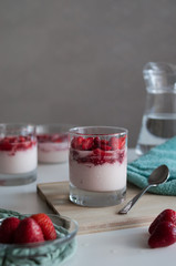 Delicious panna cotta with fresh strawberry berries on table in the kitchen