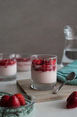 Delicious italian deesert with fresh strawberries in the kitchen. Tasty panna cotta with sweet red berries