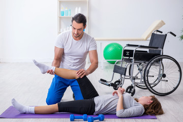 Leg injured woman doing sport exercises with personal coach