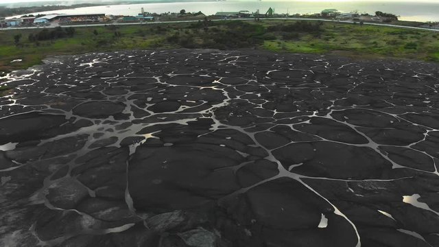 Amazing aerial of the pitch lake, the largest natural deposit of asphalt in the world located in la Brea, Trinidad