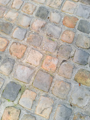 Obraz premium Beautiful stone pavement sidewalk. Vertical picture. 