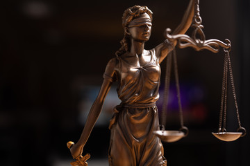 Statue of lady justice on bright background - Side view with copy space..