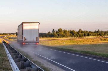 Emergency braking of a loaded truck on dry asphalt. Safety concept and stopping distance with ABS,...