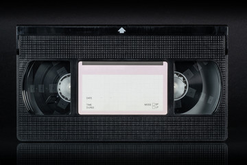 Video cassette VHS on the black background.