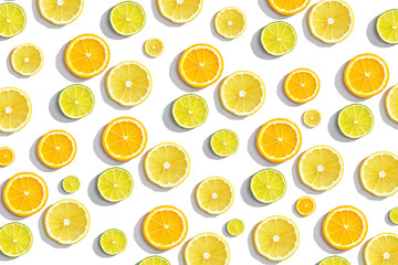 slices oranges, lime on white background, summer citrus background