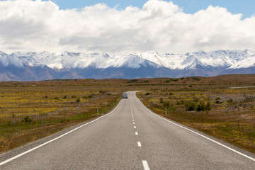 Beautiful landscape of car, road and snow mountain in South Island, New Zealand 