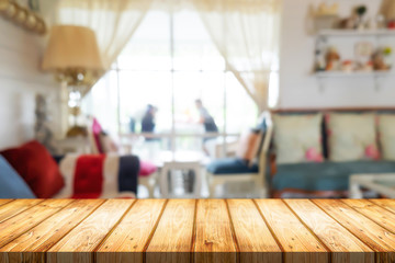 Empty wooden table space platform and blurred resturant or coffee shop background for product display montage