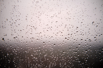 Background with water drops on the glass surface of the window, copy space for text