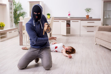 Gangster and young woman in robbery concept