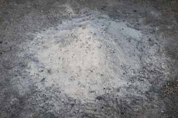 Gray white ash ashes pile heap stack from burnt campfire lumber fire