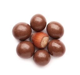 Tasty chocolate nuts on white background