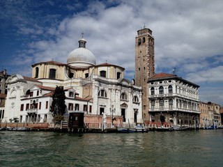 Fototapeta na wymiar Italy, Venice view from the canal. Good weather in the city on the water.