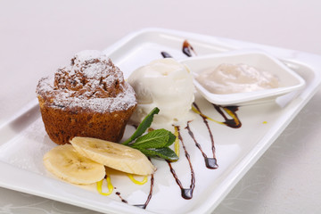 Tasty hot muffin with ice cream
