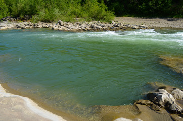 mountain river between sheer cliffs . blue clear water of the river.
