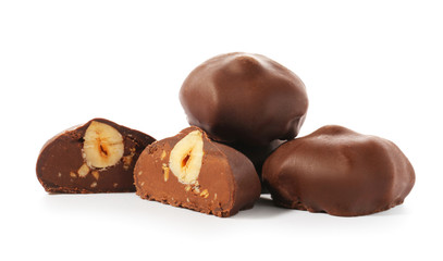 Tasty chocolate candies on white background