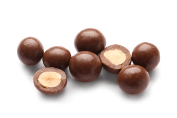 Tasty chocolate nuts on white background