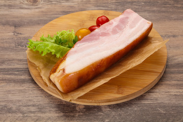 Smoked pork breast with salad leaves