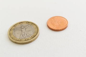 Euro coins with one cent on white background economy finance earning concept 