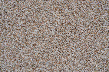 close view of the wall surface, decorative finishing, heat insulation granules or granite particles
