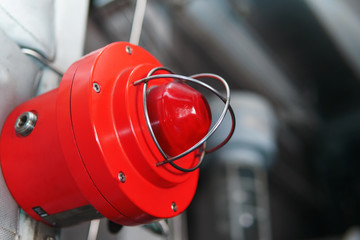 Red warning light of a fire system at an industrial facility.