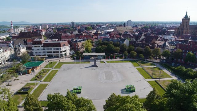 Aerial drone shot of the city of Colmar in Alsace France. Quiet street during summer with blue sky. Place Rapp.