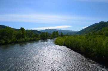 mountain river between sheer cliffs . blue clear water of the river.