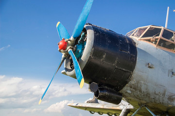 old airplane against the sky. vintage biplane on the field