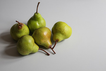ripe fresh yellow pears on a white background close up