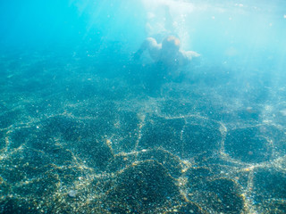 Being underwater. Clean aegean sea. Nature on the island Santorini, Cyclades, Greece