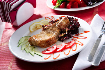Roasted steak on white plate.Meat and sauce.