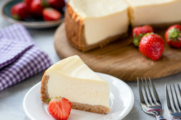 Cheesecake with strawberries on plate. Homemade cheesecake. New York style cream cheese cake