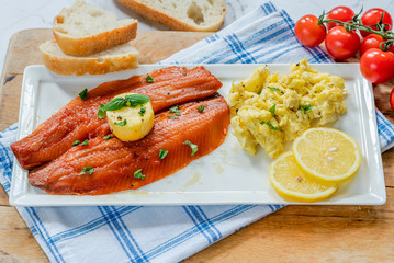 Smoked kipper brunch with scrambled egg and tomatoes