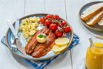 Smoked kipper brunch with scrambled egg and tomatoes