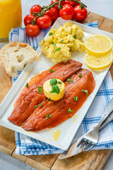Smoked kipper brunch with scrambled egg and tomatoes