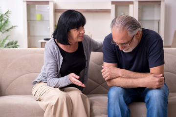 Old couple having argument at home
