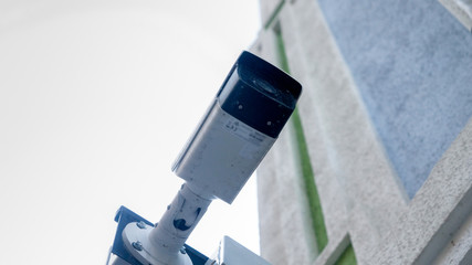 Fototapeta premium Closeup photo of surveillance camera installed on building side