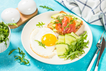 Healthy breakfast with egg, toast and salad.