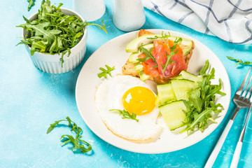Healthy breakfast with egg, toast and salad.
