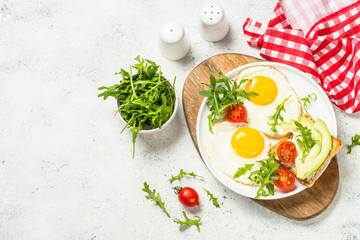 Healthy breakfast with egg, toast and salad.