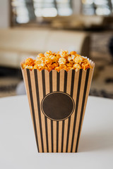 Popcorn in a striped carton box