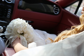 bride and groom in car bridal bouquet on the table car flower wedding bride floral red love beautiful tapes beauty dress romantic