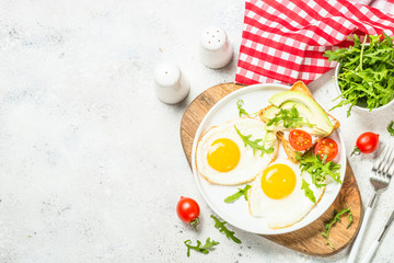 Healthy breakfast with egg, toast and salad.