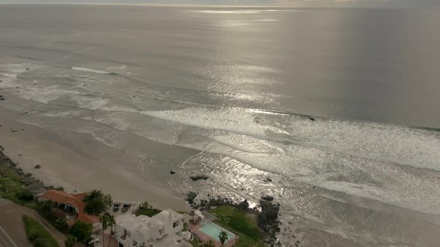 Following a para glider at the coast of Mexico during the sunset