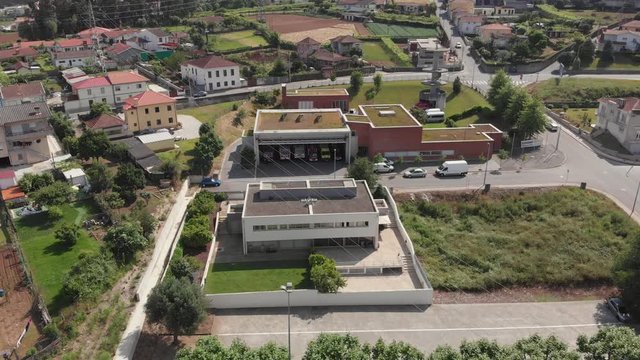 AERIAL DRONE FOOTAGE - The Santo Tirso Volunteer Firefighters Humanitarian Association fire station (Bombeiros Voluntarios Santo Tirso) in the district of Porto in Portugal.