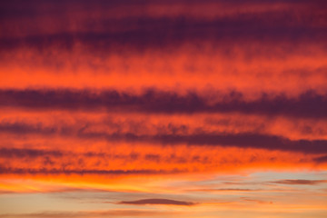Fototapeta na wymiar Dramatic red sunset sky in the sea