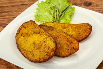 Baked potato with herbs and spices