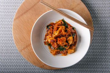 Homemade spicy pork belly cooked with kimchi, spring onions, onion and tofu. Marinated with red chilli paste called gojuchang.