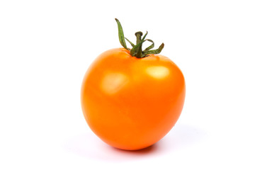 Yellow fresh tomato isolated on white background in close-up