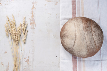 Fresh bread on the rustic white table flat lay background with copy space.